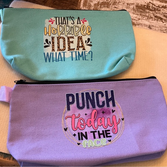 Handbags - Hot off the press! Set of 2 make-up bags, NWOT